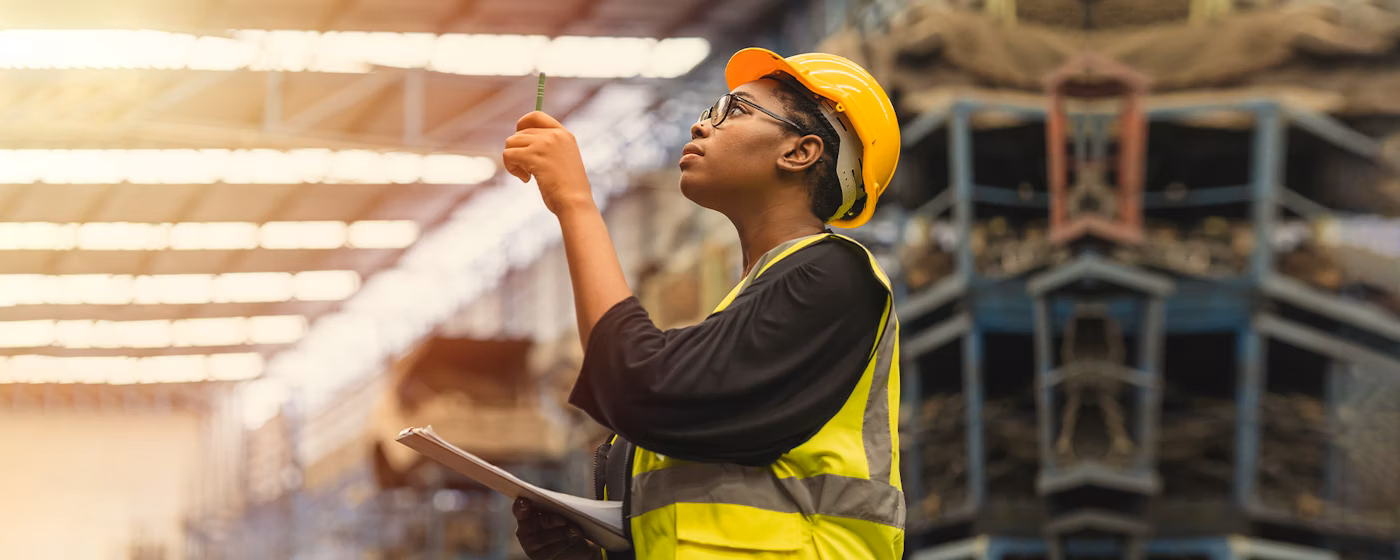 A grocery retail worker examines inventory for festival foods asset monitoring and maintenance