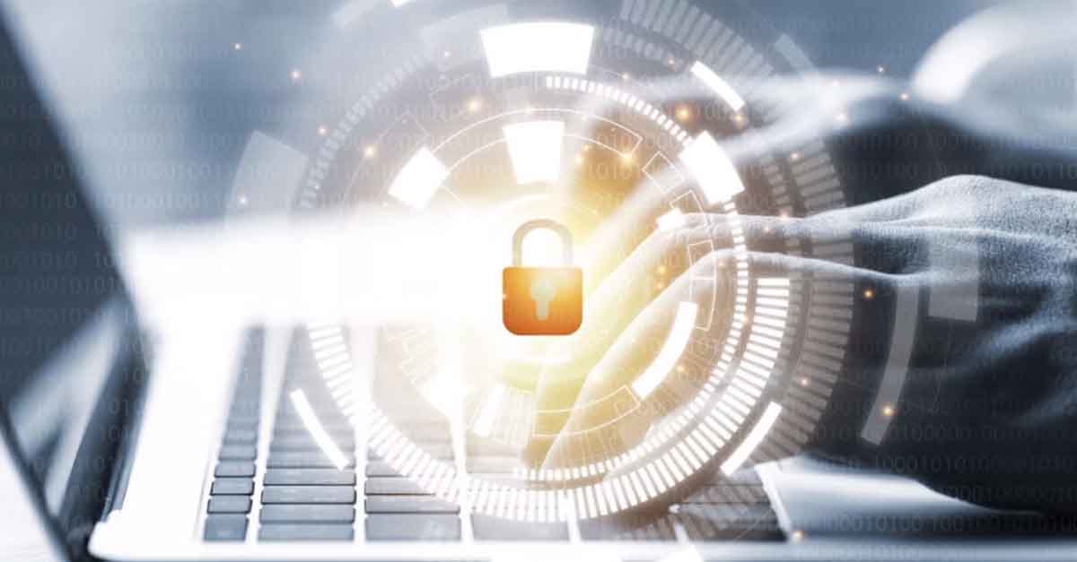 Cybersecurity concept with a glowing lock icon over a laptop.