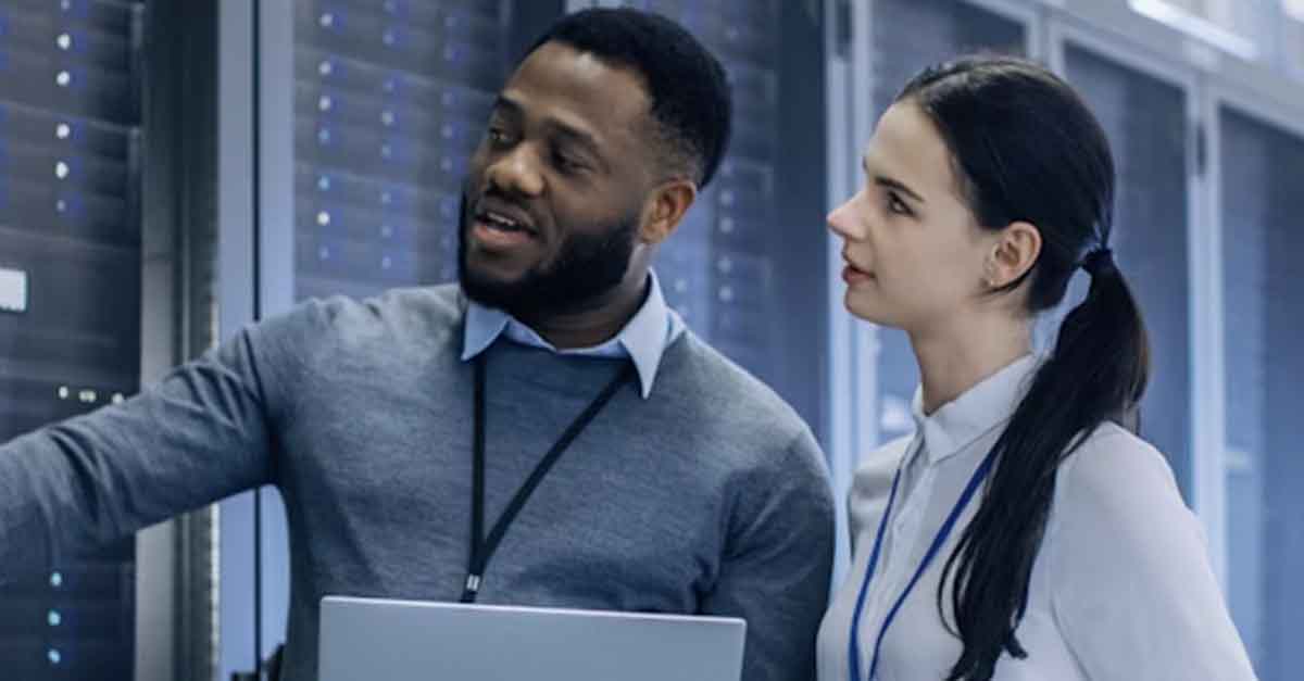Two IT professionals working to improve data integrity using Meridian