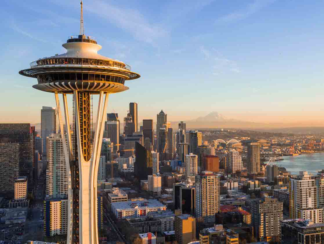 Seattle skyline featuring the Space Needle at sunset.
